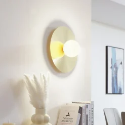 Lindby vegglampe Zain, gull/hvit, glass, Ø 33 cm, G9 Outlet