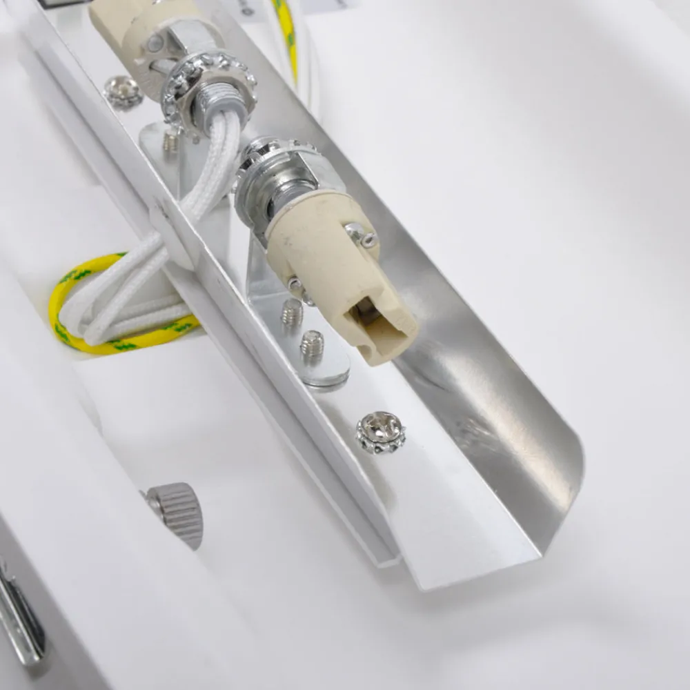 Lindby Svakt buet vegglampe Leander, malbar Discount